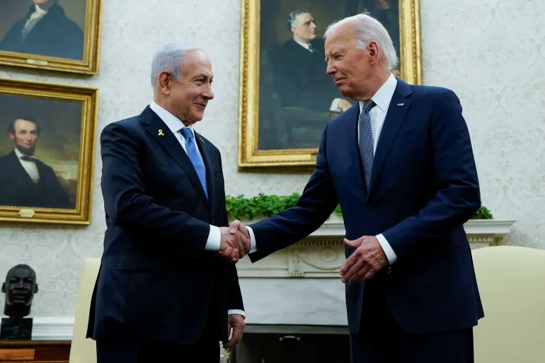 US President Joe Biden shakes hands with Israeli Prime Minister Benjamin Netanyahu